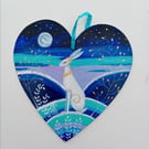 White hare golden leaves  on a wooden heart 