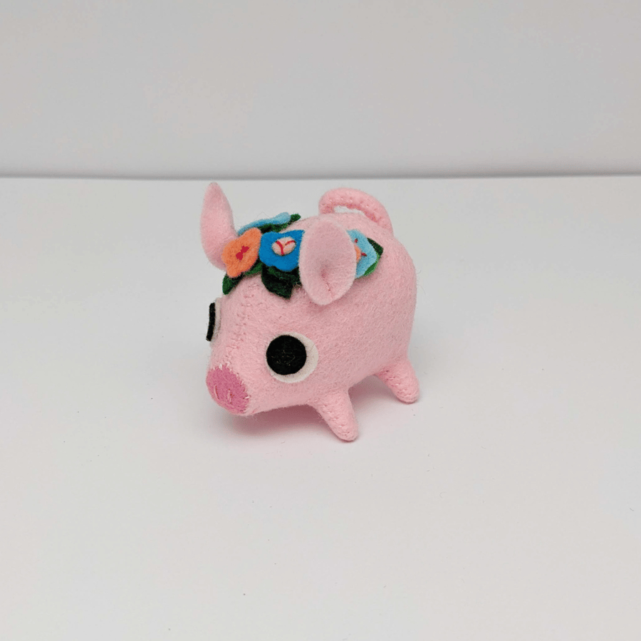 Pink felt pig ornament with a flower crown