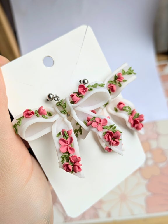 Bow translucent earrings with floral pattern