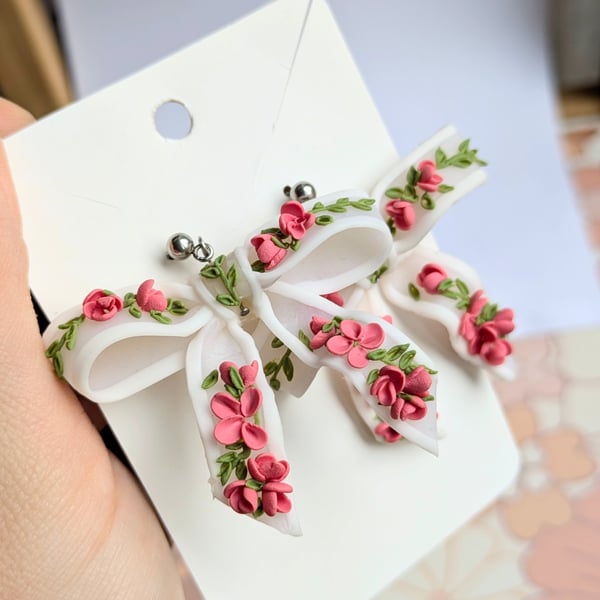 Bow translucent earrings with floral pattern
