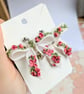 Bow translucent earrings with floral pattern