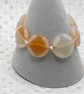 Knotted white cord bracelet with apricot agate stones - Image 2