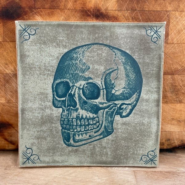 Handmade stoneware tile with skull image