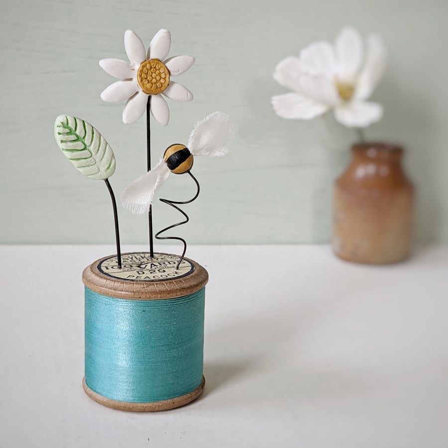 Clay Flowers and Bee on a Vintage Bobbin