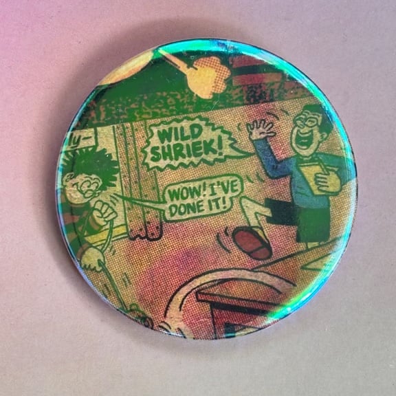 Holographic vintage book pin badge - Dennis the Menace wild shriek