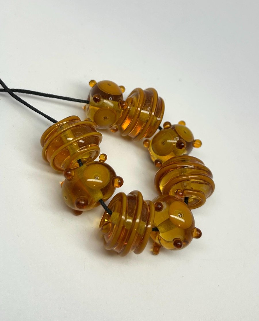 Handmade amber lamp work glass beads
