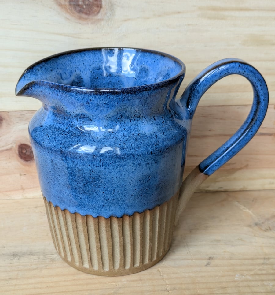 Large wavy blue carved jug (shoulder)