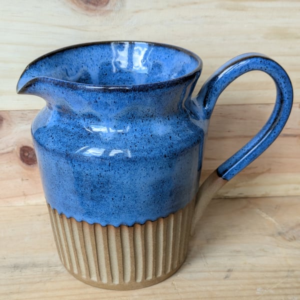 Large wavy blue carved jug (shoulder)