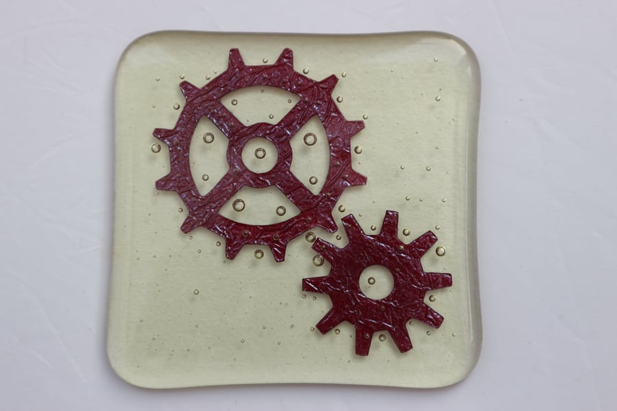 Handmade fused glass coaster - copper cogs on amber tint