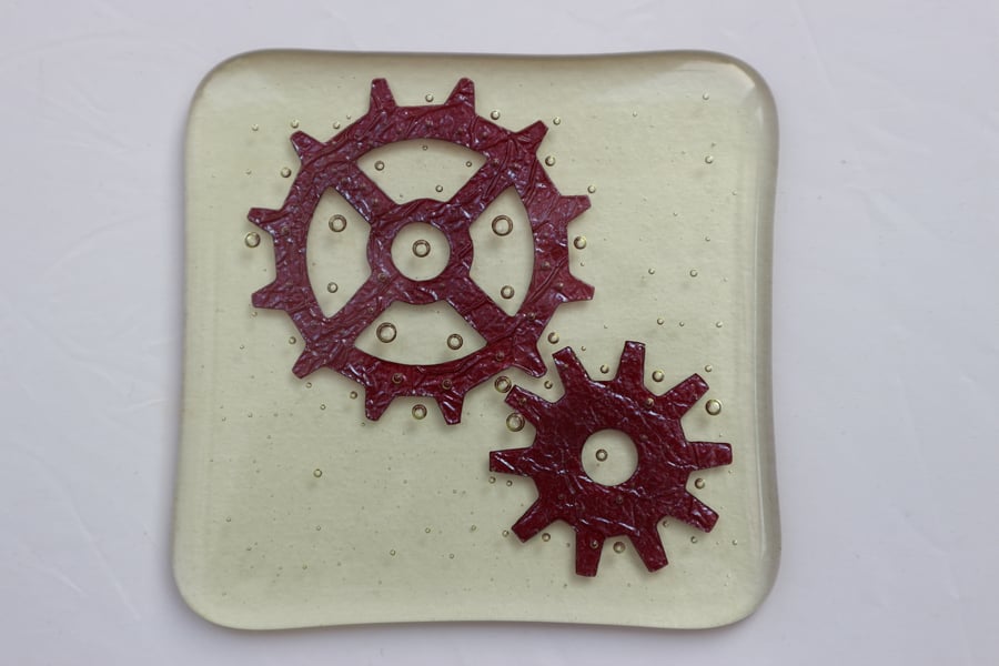 Handmade fused glass coaster - copper cogs on amber tint