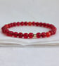 Red-orange faceted agate gemstone stretch bracelet 