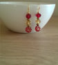 RED AND GOLD FLOWER GLASS BEAD EARRINGS. - Image 2