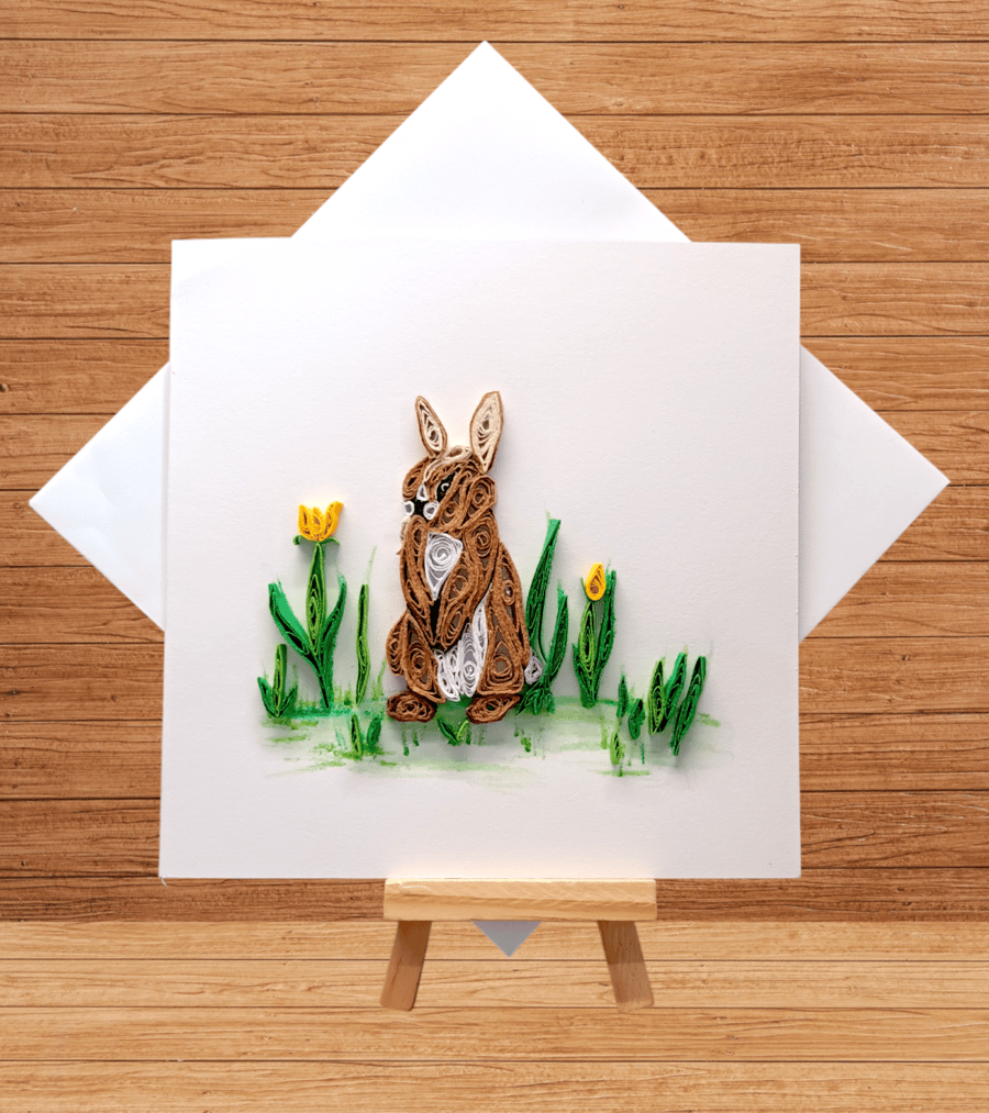 Delightfully quilled rabbit in the garden open card