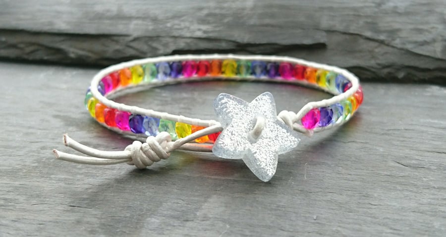 Rainbow bracelet with silver leather cord and glittery star button