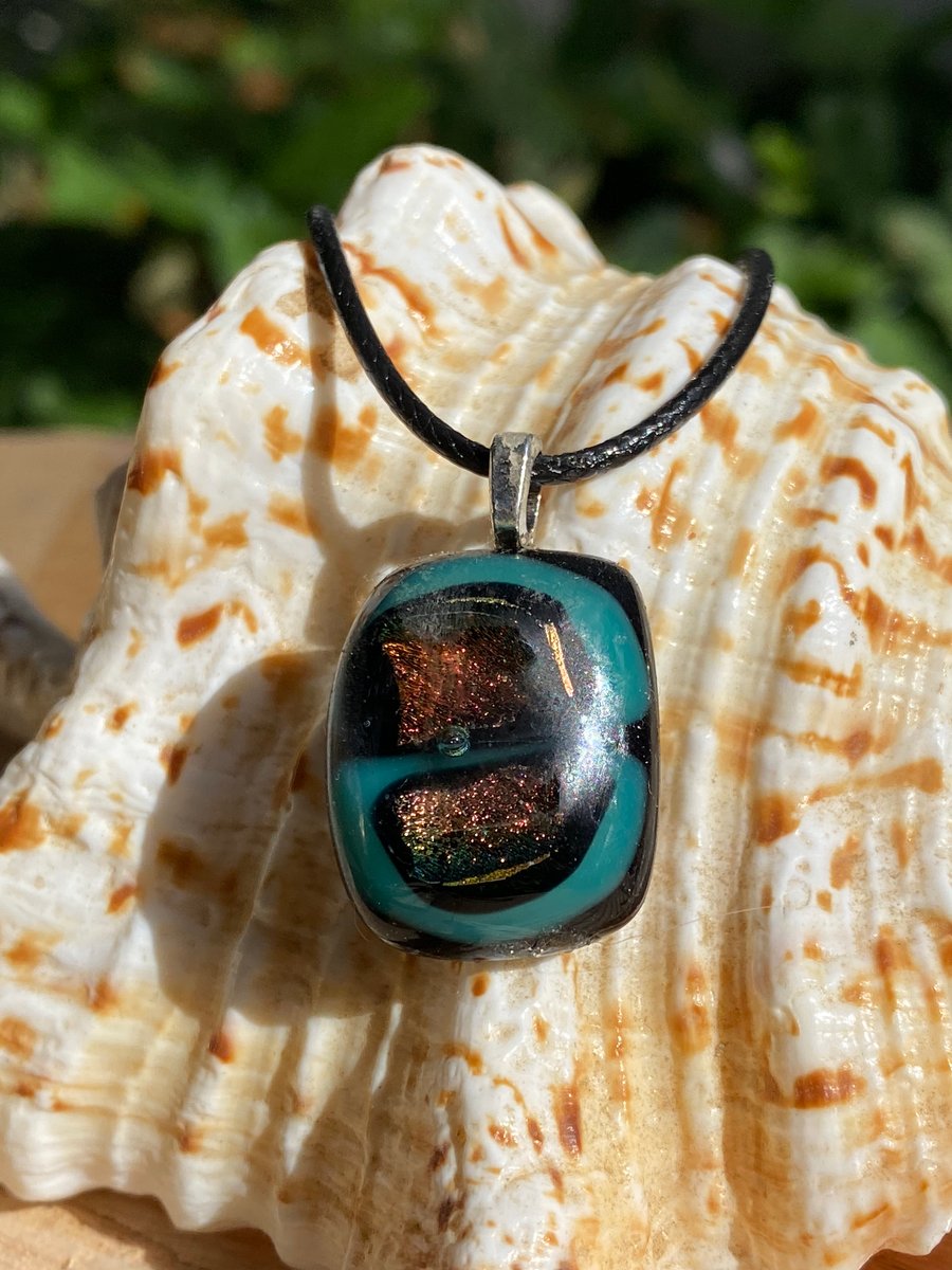 Iridescent, turquoise and black fused glass pendant