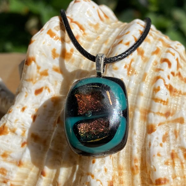 Iridescent, turquoise and black fused glass pendant