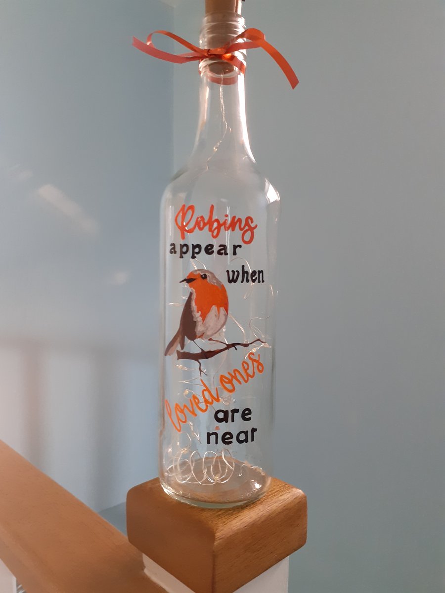 Robins appear when loved ones are near, bottle lamp