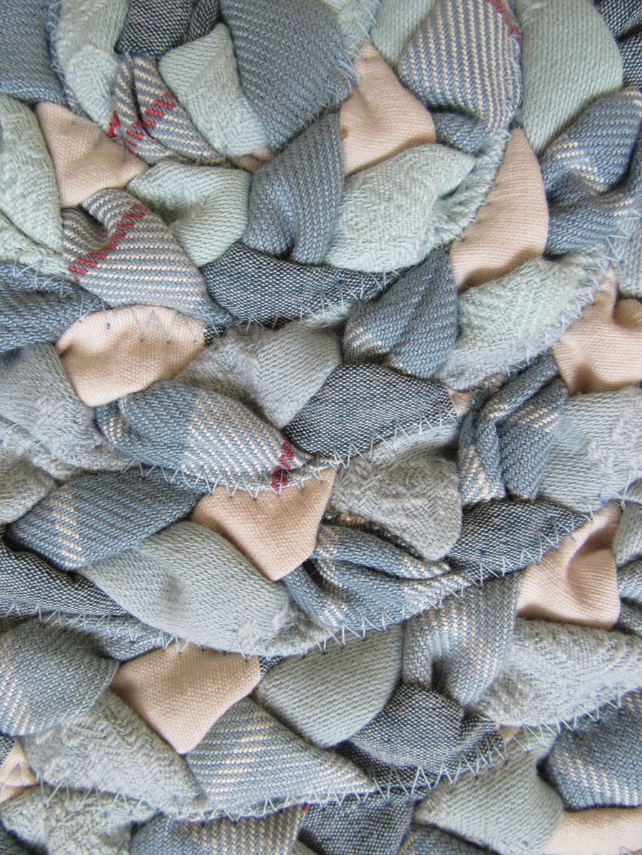 Hand braided duck egg blue oval rug