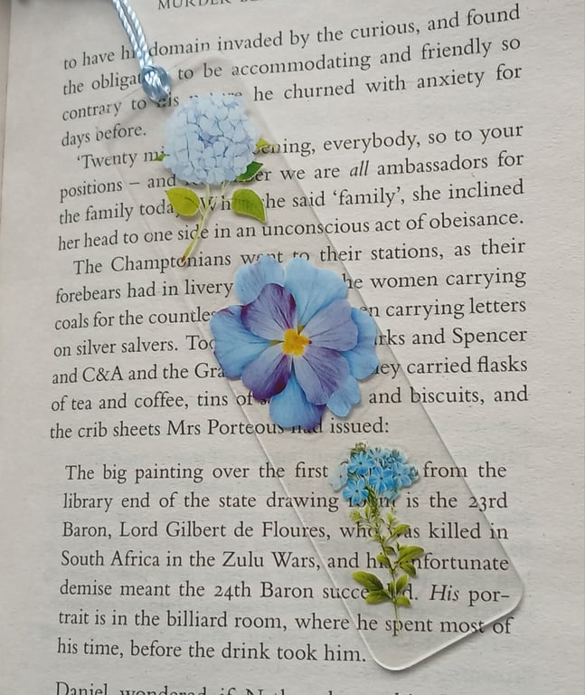 Clear acrylic bookmark decorated with blue flowers decals 