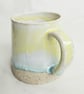 A handmade stoneware mug in yellow, green and oatmeal - Image 3