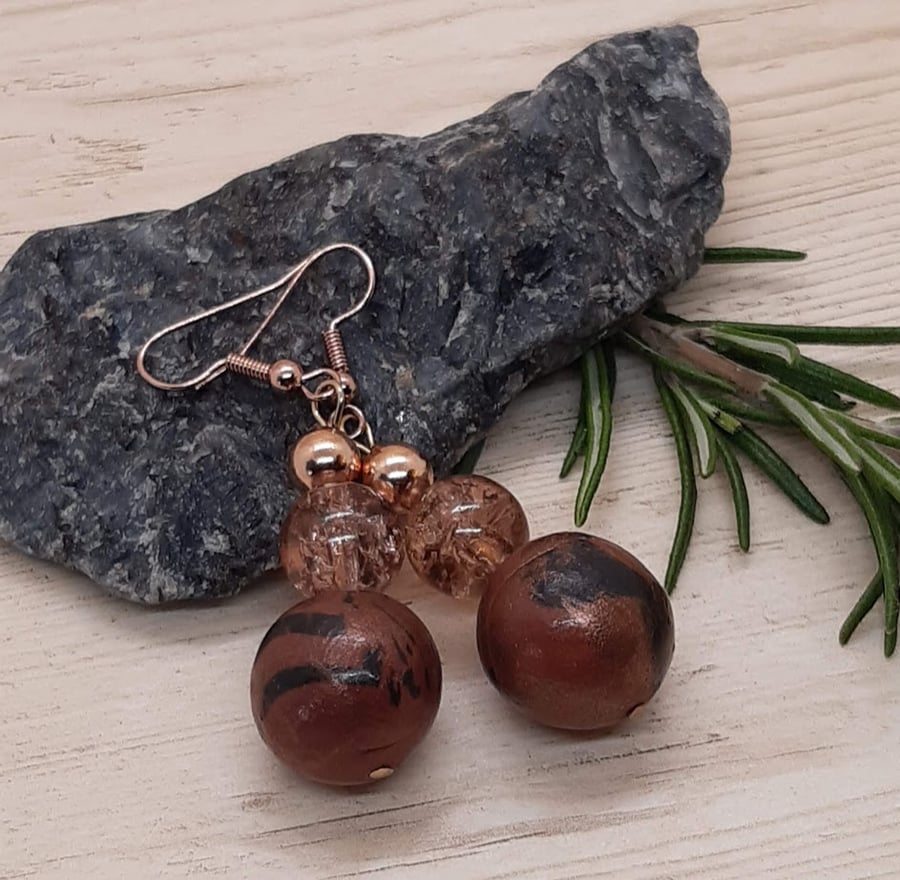 Conker brown and black dangly earrings with a bronze sheen