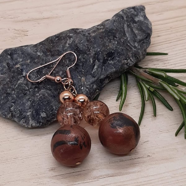 Conker brown and black dangly earrings with a bronze sheen
