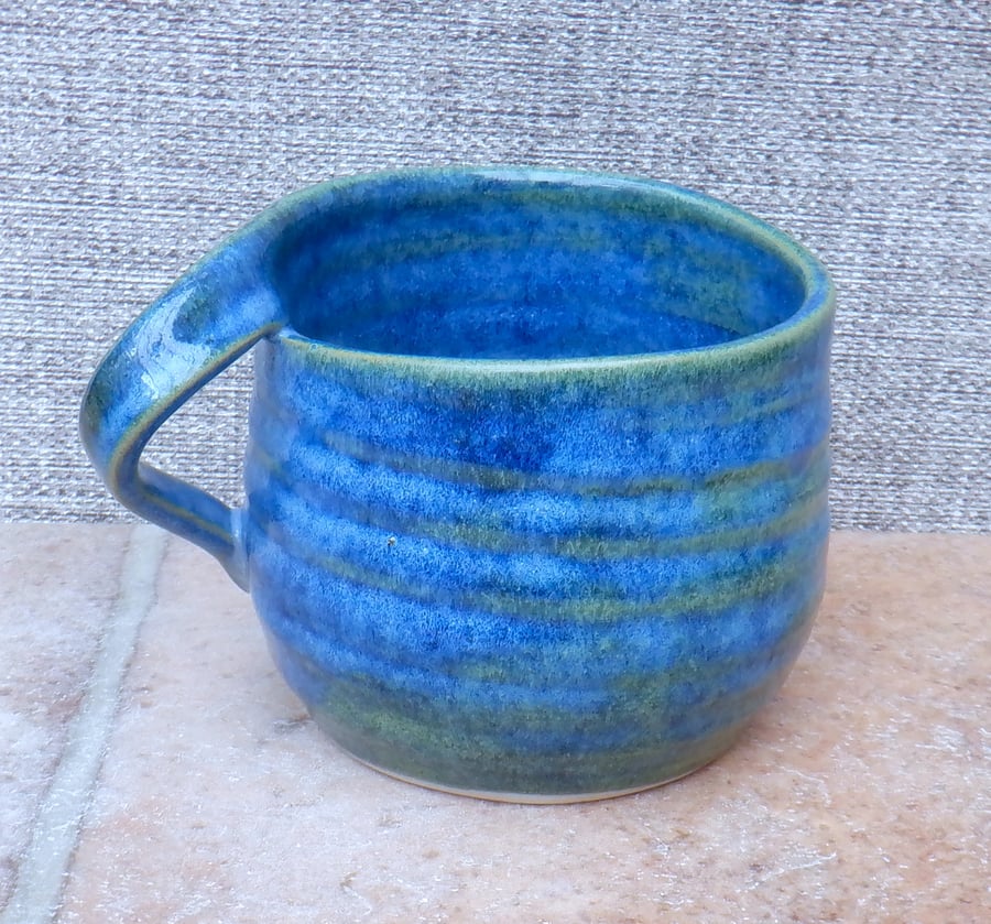 Left handed coffee mug tea cup in stoneware hand thrown ceramic pottery