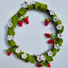 Handmade crocheted bees and sparkling beaded strawberry wreath
