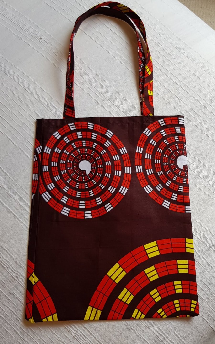 African tote bag: red and yellow spirals 