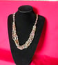 Crocheted necklace, lightweight in pastel shades of pink and yellow - Image 1