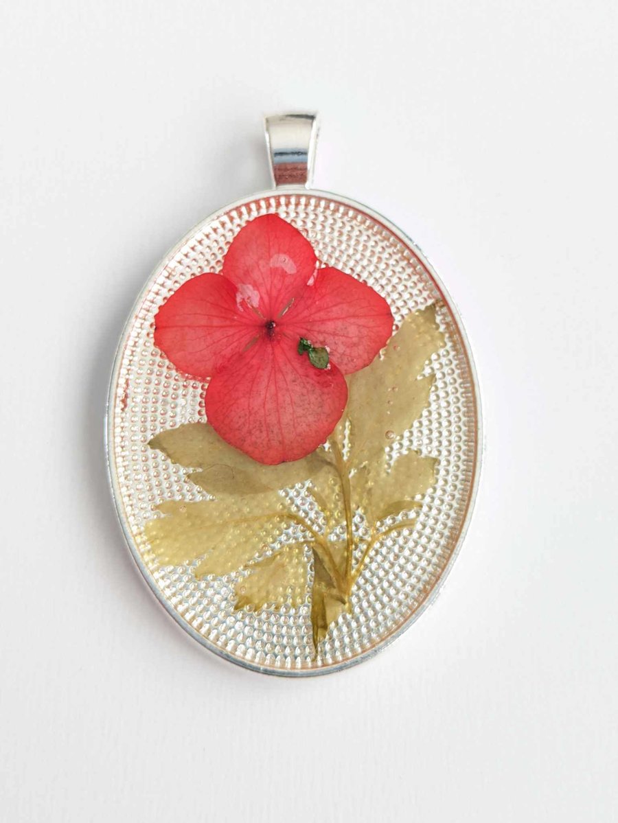 Large Resin Oval Pendant With Red Flower
