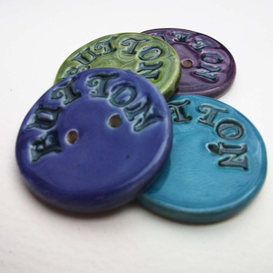 set of four large ceramic buttons