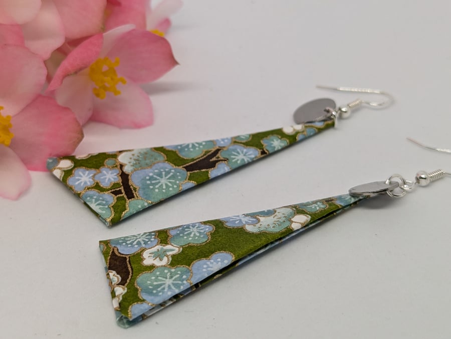 Long triangle paper earrings; green background with small white flowers