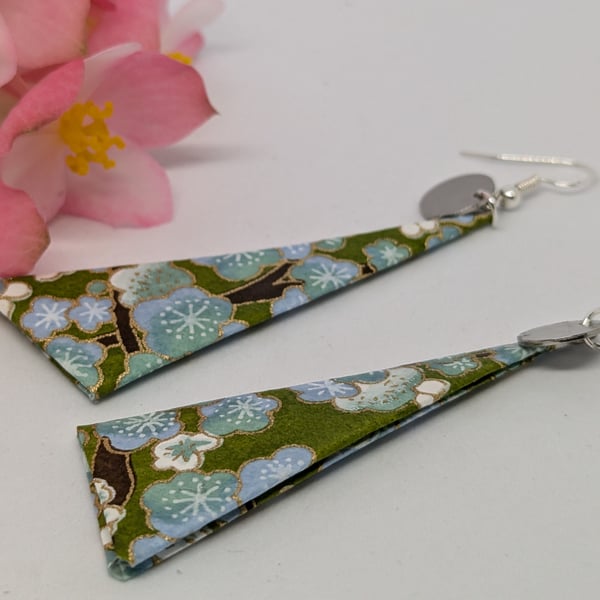 Long triangle paper earrings; green background with small white flowers