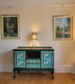 Upcycled wooden vintage ball and claw footed sideboard with a tropical theme