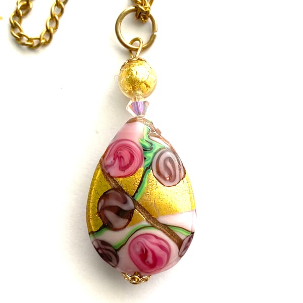 Murano glass gold and pink pear drop pendant with Swarovski crystal.