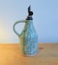 Oil or vinegar drizzler, white. turquoise glaze homemade pottery
