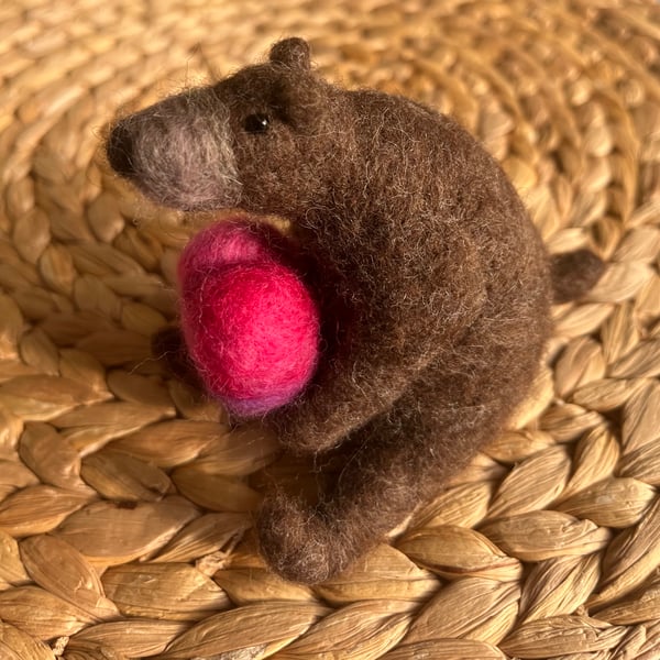 Needle felted bear holding a heart