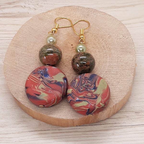 Distinctive polymer clay disc shaped earrings