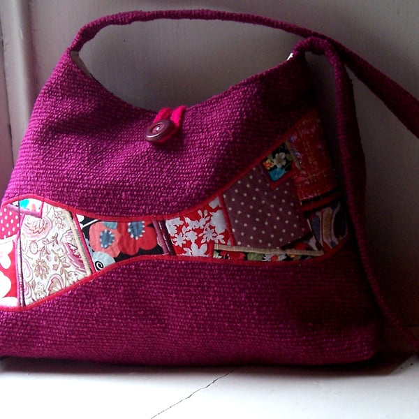 Soft textile handbag in magenta with feature panel of mixed patchwork