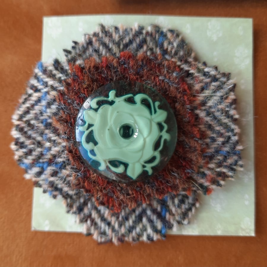 Handmade tweed brooch with swirly green button