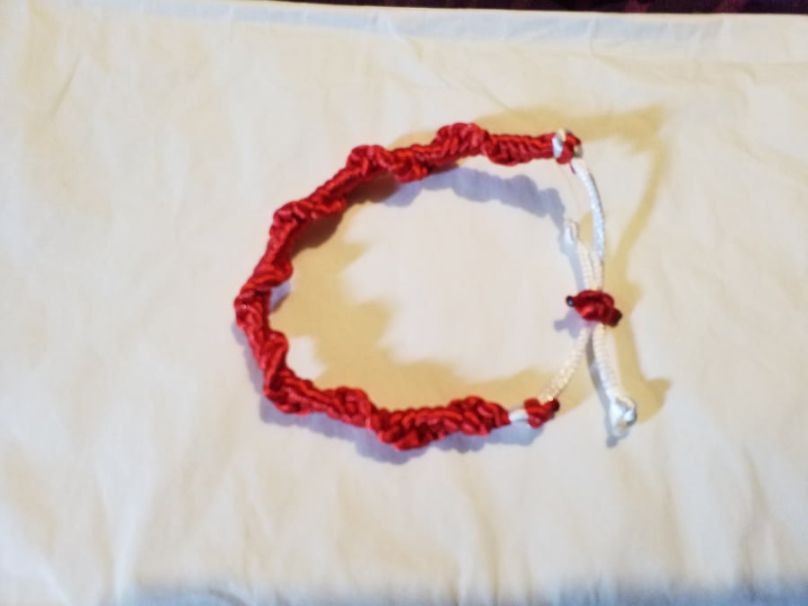 Handmade red macrami bracelet. Adjustable.