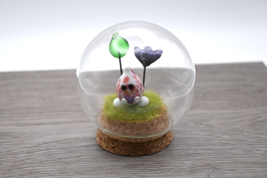 small glass wisp with heart and flowers