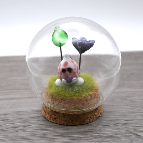 small glass wisp with heart and flowers