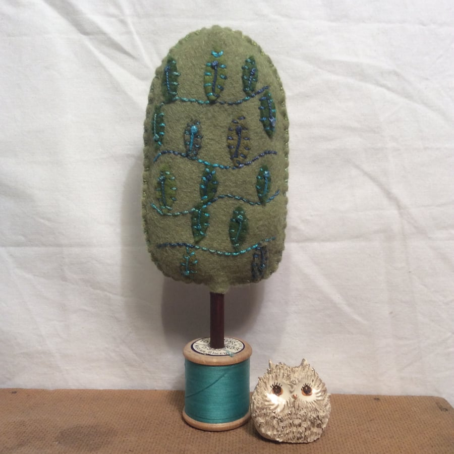 Cotton reel tree - green with turquoise  leaves 