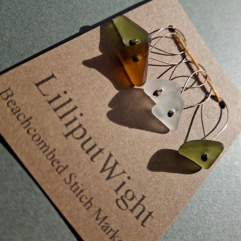 Five green, white and brown sea glass stitch markers
