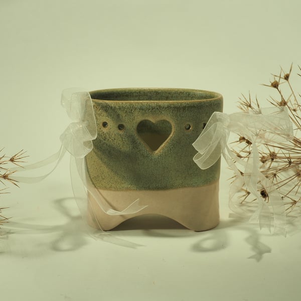 Ceramic oval bridge vase with heart cut-out and ribbons