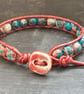Red and blue rainbow jasper and leather bracelet with ceramic button fastener - Image 10