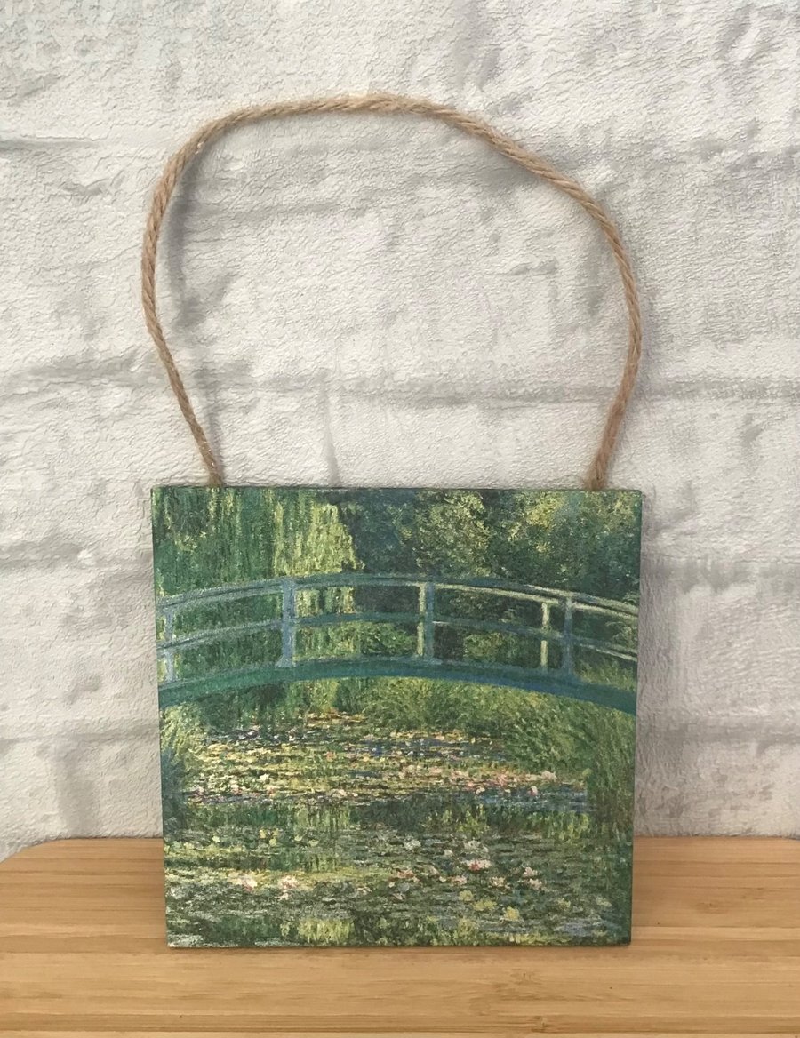 Image of Claude Monet's Water-Lily Pond. Wooden hanging wall plaque picture.