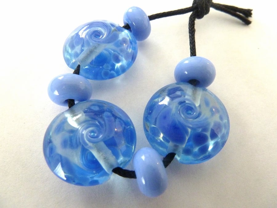 blue swirl lentil lampwork beads